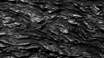 Dark rough stone wall background in vintage style for graphic design