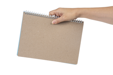 Blank book cover in hand on transparent background.