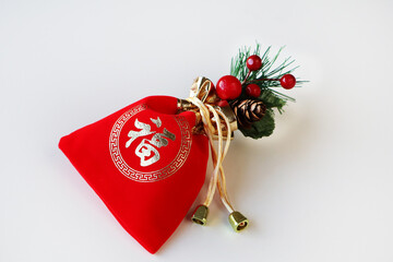 Chinese New Year, lucky pouch, red packet, prosperity bag, Fu symbol, good fortune, lunar new year, red and gold, festive decoration, holiday ornament, celebration, tradition, prosperity, wealth symbo