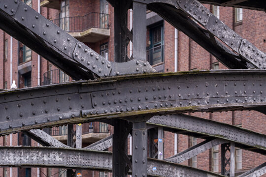Urban metal structure with beam geometry and infrastructure detail showing industry pattern and contrast in a strong graphic architectural composition