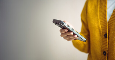 Person using smartphone for digital communication concept of mobile technology online connection social networking and modern lifestyle in everyday life