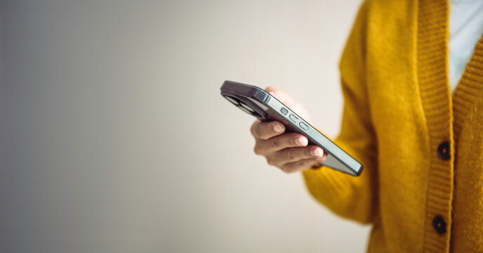 Person using smartphone for digital communication concept of mobile technology online connection social networking and modern lifestyle in everyday life