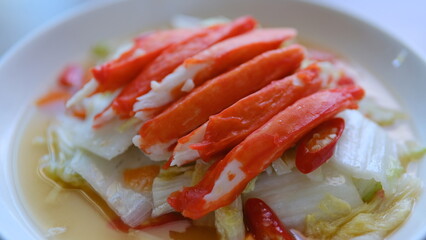 Table top view napa cabbage with crab stick isolate on white plate