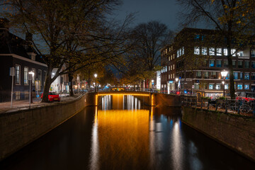 Illuminated bridge in Amsterdam at night