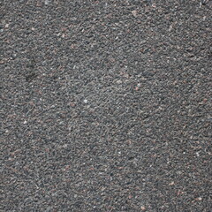 The texture of the asphalt surface on the highway