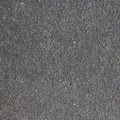 The texture of the asphalt surface on the highway