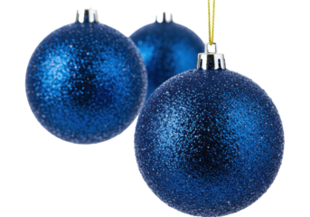 three reflective, royal sapphire blue glitter christmas bauble ornaments suspended by thin gold strings in a high-key macro studio setup. concept of elegant festive atmosphere