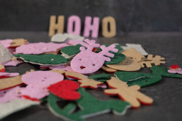 Colorful holiday decorations scattered on a tabletop during festive preparations for a seasonal celebration