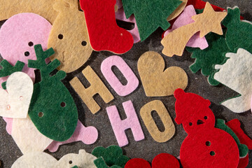Festive felt cutouts on a dark surface for holiday crafting and decoration