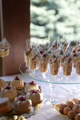 Elegant wedding candy bar with assorted mini desserts and sweet treats