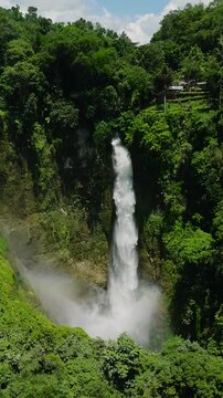 Drone view of mist from Waterfalls in Lake Sebu, South Cotabato. Mindanao, Philippines. Vertical view.