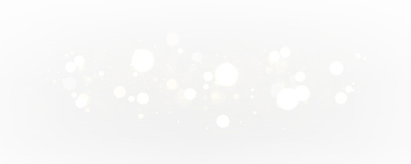 Magical glitter dust and sparkling light flare on transparent background. White and golden particles create glowing festive effects for holiday, Christmas, and winter designs.