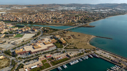 Fototapeta premium Aerial view of Licata, located in the province of Agrigento, Sicily, Italy. It is a small town built at the mouth of a river.