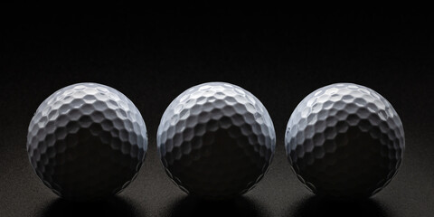 Golf balls in dim lighting and shadows