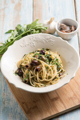 spaghetti with anchovy capers  black olives and parsley
