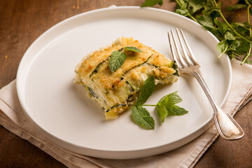 Zucchini flan with cheese and mint leaves