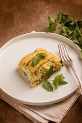 Zucchini flan with cheese and mint leaves