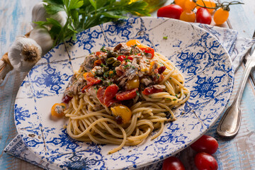 spaghetti with fresch anchovy  tomato and capers