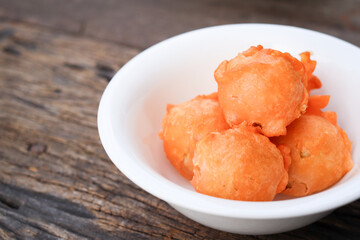 Crispy snack meatballs on wood background