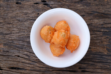 Crispy snack meatballs on wood background