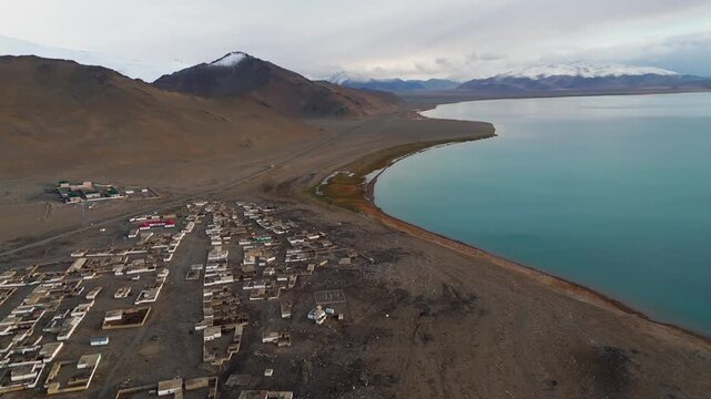 Aerial view of Karakul village on the shore of Lake Karakul, Pamir Mountains, Tajikistan