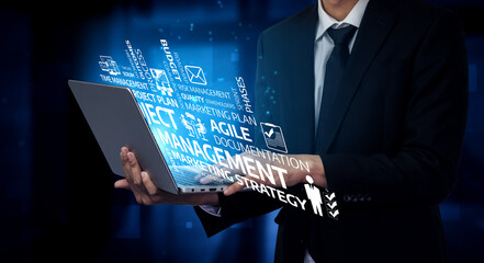 A business professional stands confidently with a laptop, highlighting key project management terms and agile strategies for success in today digital landscape. Tessel