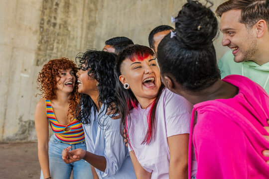 Diverse group of young adult friends laughing together