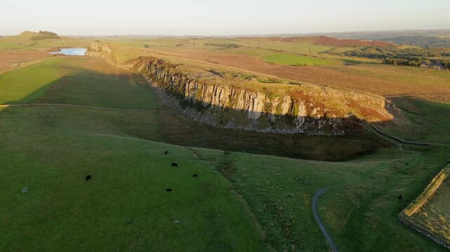 Northumberland UK: 25th Sept 2025: Sycamore Gap at Hadrian's Wall captured by drone during golden hour, showcasing stunning natural beauty and ancient history