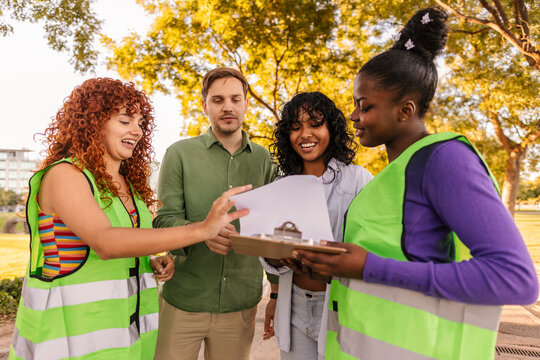 Volunteers discussing activism with people in a public park