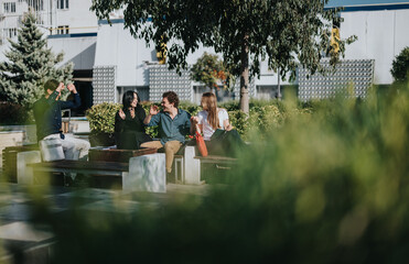 A sunny outdoor gathering of colleagues and friends sharing conversation and ideas, with laptops and relaxed body language in a modern urban courtyard.