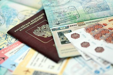 Fragment of Russian Federation visa in passport page and russian money close up. Concept of travel and tourism in Russia