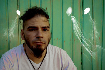 Troubled adult male facing ghostlike entities and deep psychological distress