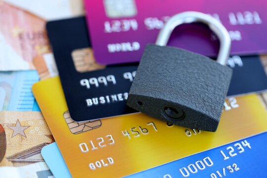 Euro money bills banknotes and credit cards with padlock. Concept of online banking safety and security