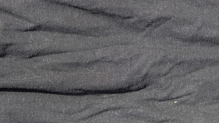Black wrinkled t-shirt fabric texture background. Inner fabric. For banners, 3D rendering and graphic design