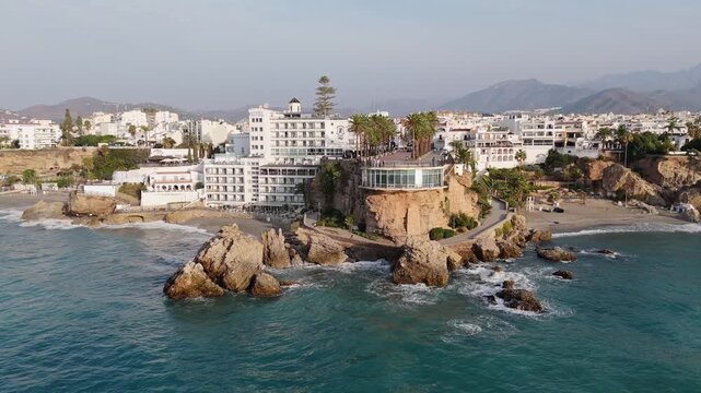 Aerial Drone POV of Nerja coastal town, which is a municipality on the Costa del Sol in the province of Malaga in the autonomous community of Andalusia in southern Spain.