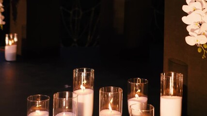 An evening romantic wedding arch of white roses for the bride and groom on their wedding day