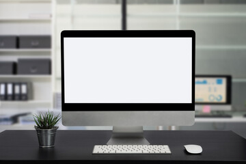 Fototapeta premium Stylish workspace with blank screen desktop computer at office background.