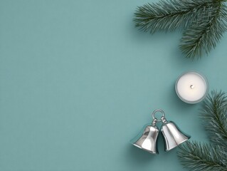 Christmas composition with silver bells and pine branches on icy mint background