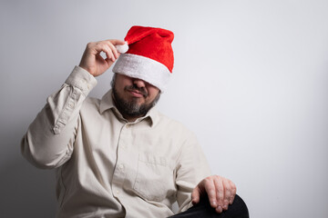 Man with santa hat pulled over eyes