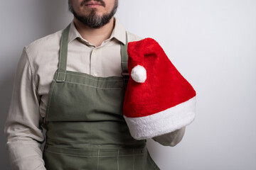Man in santa hat with copy space for festive greeting. Merry Christmas portrait.