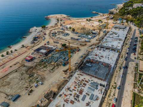 Aerial view of the stark contrast between the azure Adriatic Sea and the ongoing construction at the coastline, Split, Split-Dalmatia County, Croatia.
