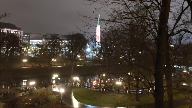 The Freedom Monument in Riga stands illuminated during the Staro Riga light festival.
