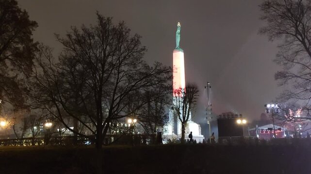 The Freedom Monument in Riga stands illuminated during the Staro Riga light festival.
