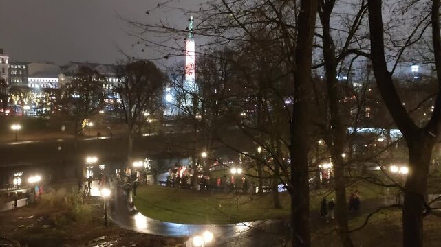 The Freedom Monument in Riga stands illuminated during the Staro Riga light festival.
