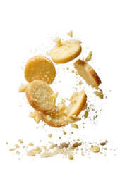 Falling shortbread circles, crumbs against black backdrop