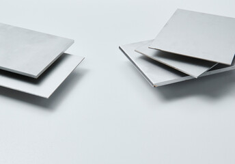 Close up image of metallic surface sheets with brushed and matte finishes, showcasing industrial...