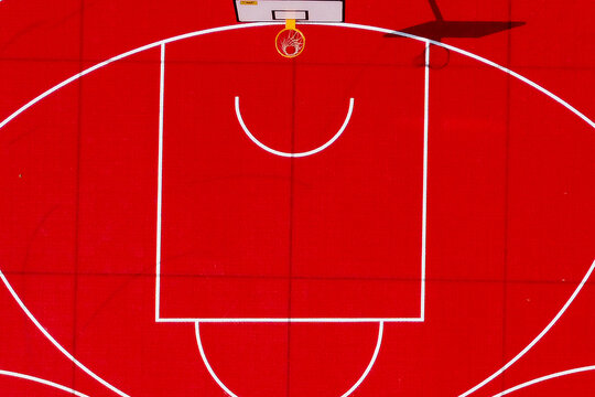 Aerial view of a vivid red basketball court with stark white lines, a geometric dance under the sun, Sarajevo, Federation of Bosnia and Herzegovina, Bosnia and Herzegovina.