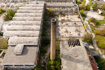 Aerial view of stark industrial decay with weathered concrete structures contrasted by the encroaching greenery, Sarajevo, Federation of Bosnia and Herzegovina, Bosnia and Herzegovina.
