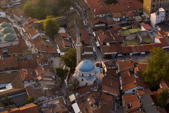Aerial view of the Gazi Husrev-beg Mosque with its distinctive blue dome amid the terracotta rooftops of the old town, Sarajevo, Federation of Bosnia and Herzegovina, Bosnia and Herzegovina.