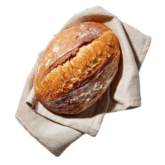 Freshly baked sourdough loaf resting on linen cloth